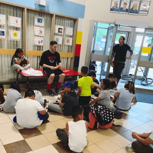 Image of a HoopLife Nations Clinic with CEO Andrew Gottselig mentoring kids
